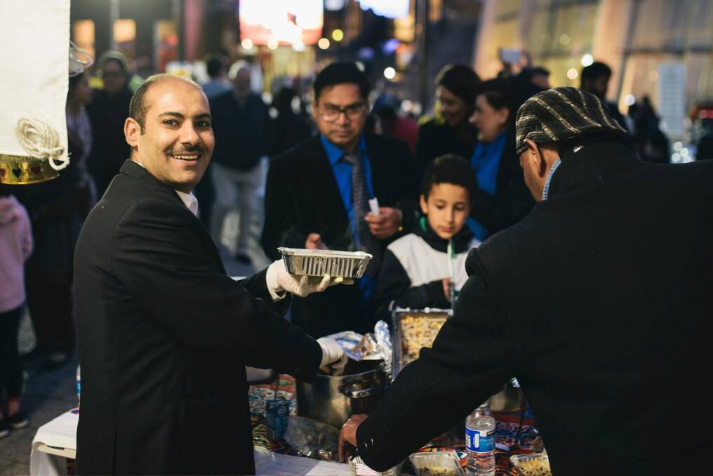 Hassan Muhammad serving Egyptian food at Ramadan Iftar on Saturday night. Photo: Rohan Thomson