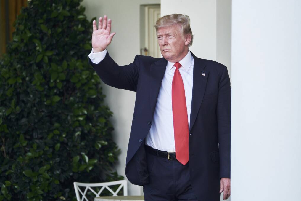 Donald Trump gestures to his White House audience last week after announcing the US would withdraw from the Paris accord. Photo: T. J. Kirkpatrick