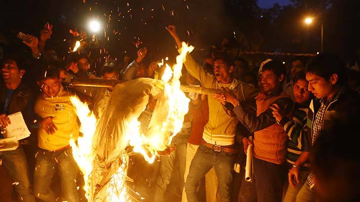 Outpouring &#8230; protesters burn an effigy depicting rapists at a rally in Delhi. The death of a young woman who was raped has triggered anger and grief. Photo: AFP