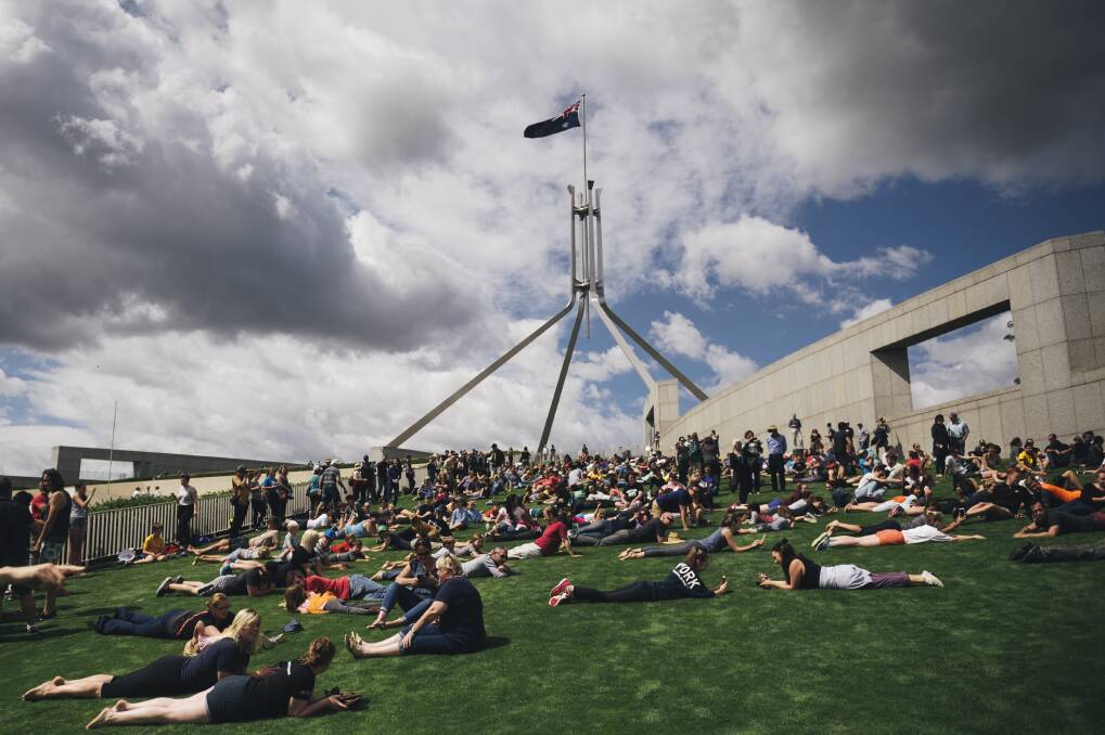 Hundreds roll down the slope of the Parliament House lawns for the last time in December 2016. Photo: Rohan Thomson