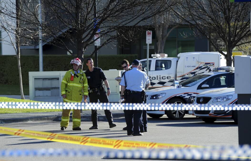 Emergency Services personnel attend the incident at Brindabella
Business Park last September. Photo: Graham Tidy