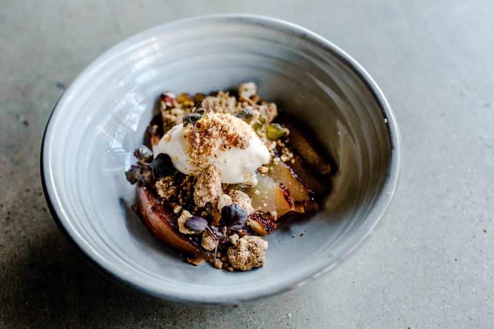Poached Bosc pear with caramelised white chocolate crumb and candied ginger ice cream. Photo: Ashley St George