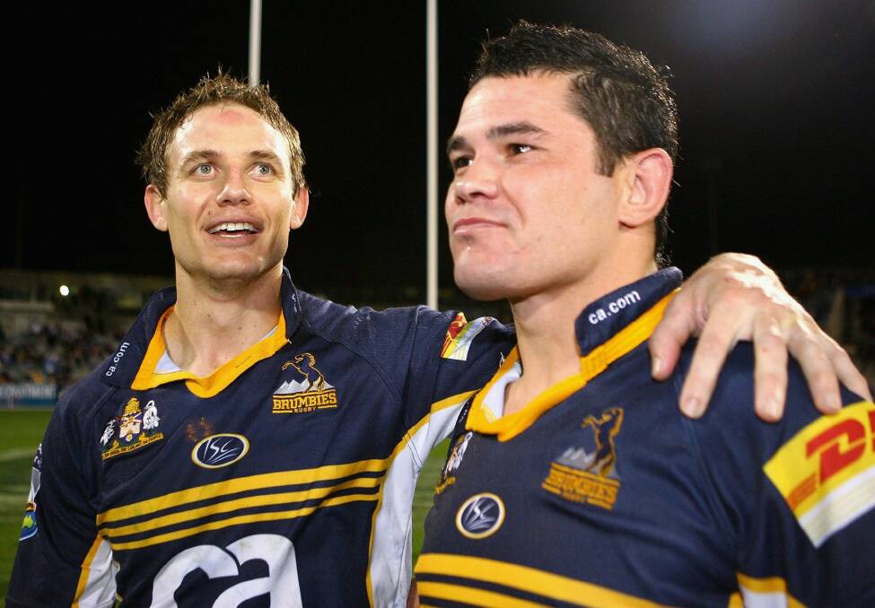 Jeremy Paul, right, with former Brumbies teammate Stephen Larkham Photo: act\daniel.briggs