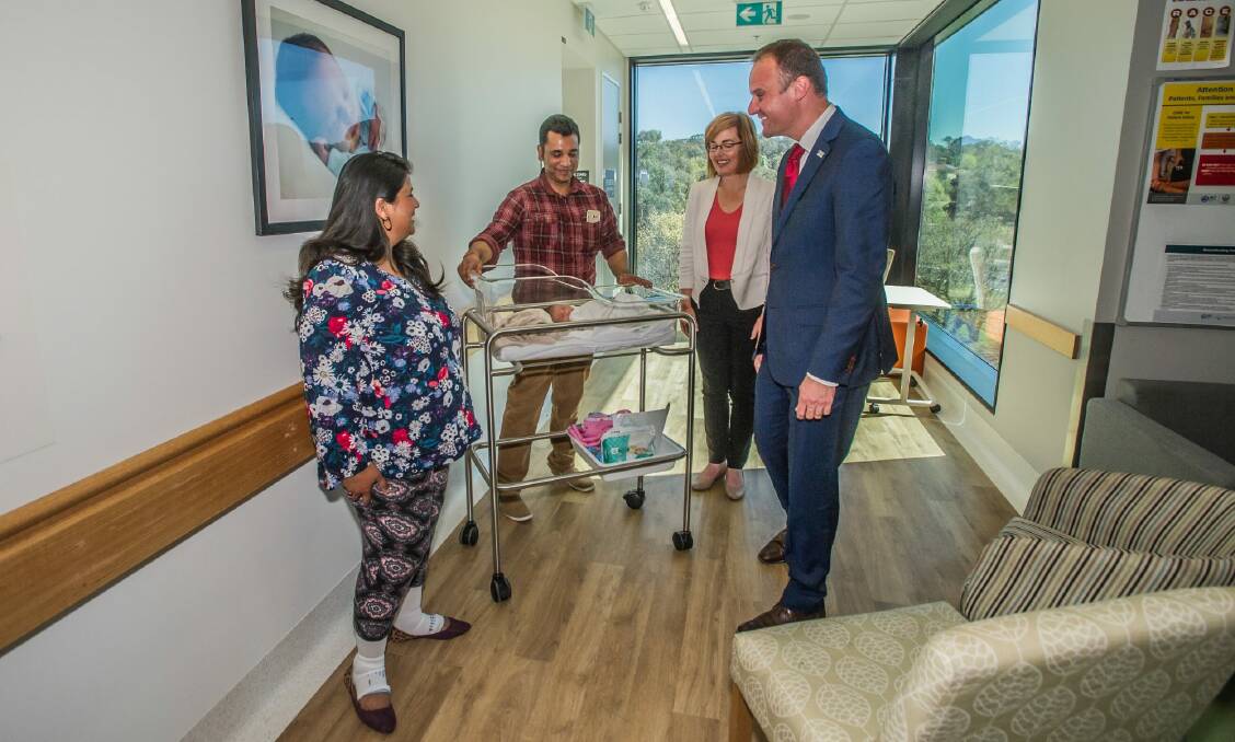 Chief Minister Andrew Barr and new Health Minister Meegan Fitzharris meet newborn Rhianna Khanna and mum Meenal and dad Sachin of Casey at the Centenary Women's and Children's Hospital, during the ACT election campaign. Photo: Karleen Minney