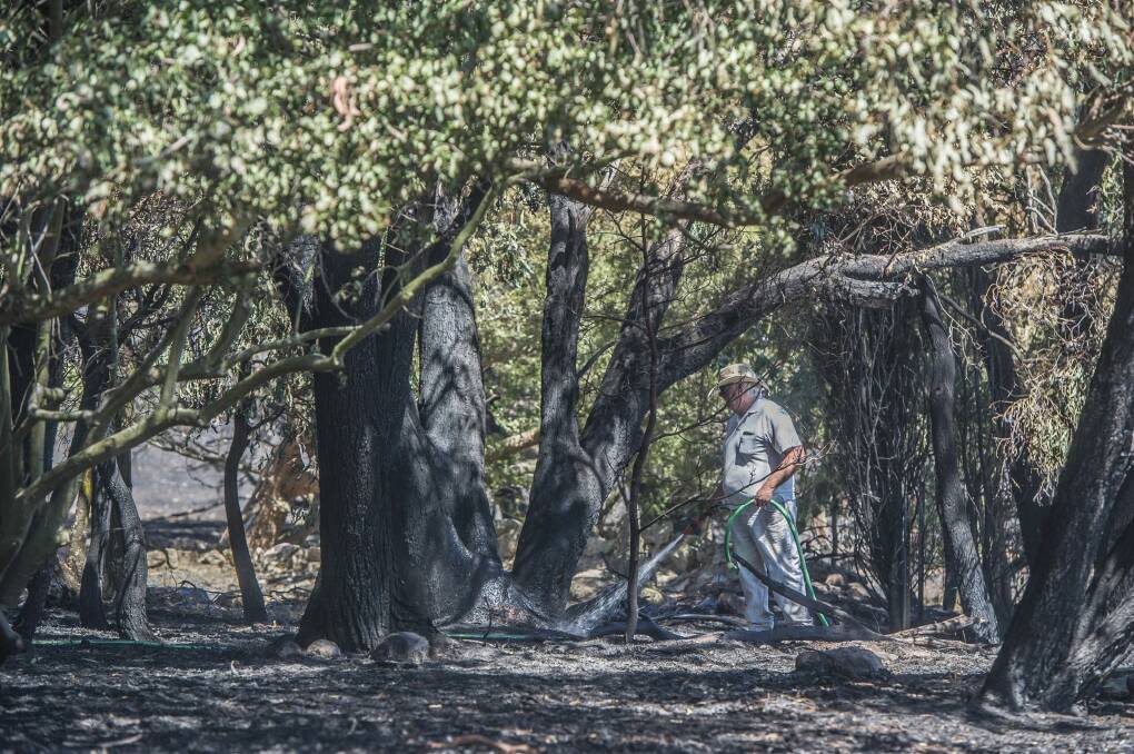 Mop-up work continues after fires in the Tarago area.  Photo: Karleen Minney