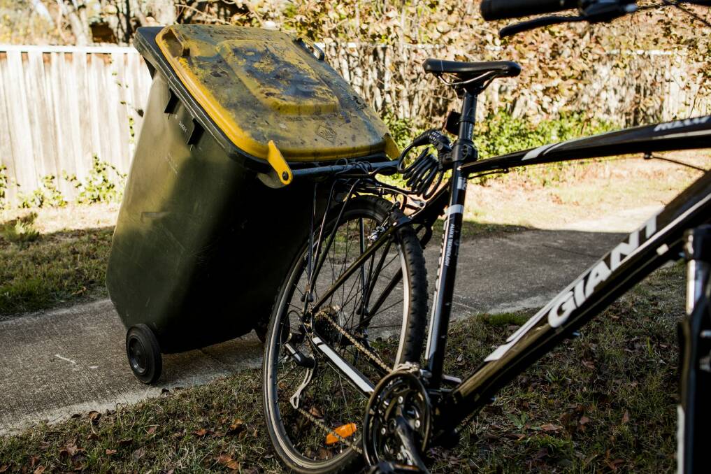 Andrew Jenson used rope to tie the bin's handles to the rack on the back of his bike.

The Canberra Times

Photo Jamila Toderas Photo: Jamila Toderas