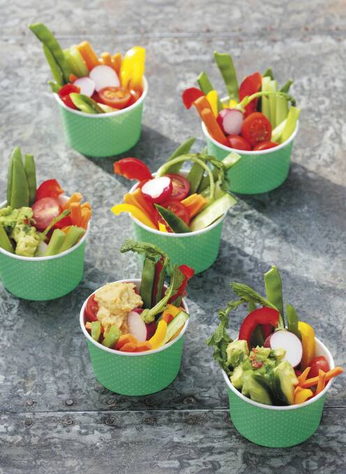Cup of colour: Vegetable sticks in paper cups. 