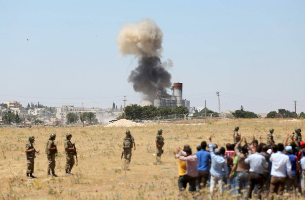 Islamic State fighters launched simultaneous attacks against the Syrian government and Kurdish militia in the Kobane in June. Photo: Reuters