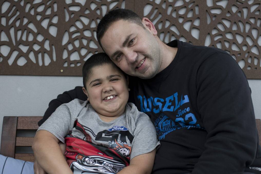 Charity founder Elie Eid with his 10-year-old son Emilio who has duchenne muscular dystrophy. Photo: Sahlan Hayes