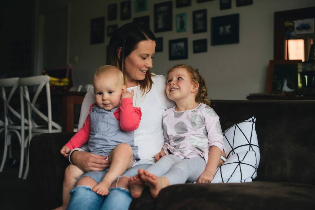Rebecca Kiddey with her two children Olivia, 3, and Matilda, 1 at home in Macgregor Photo: Rohan Thomson