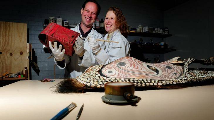 Conservators Andrew Pearce and Victoria Gill at their shop Endangered Heritage in Phillip. Photo: Melissa Adams 