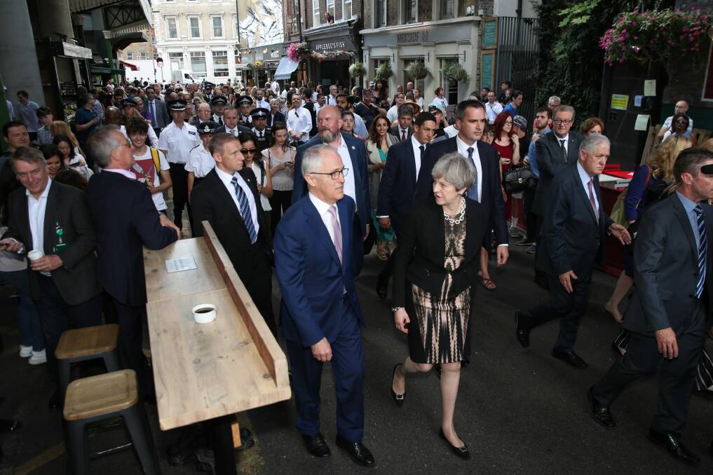 Turnbull and Ms May visit Borough Market in London. Photo: Andrew Meares