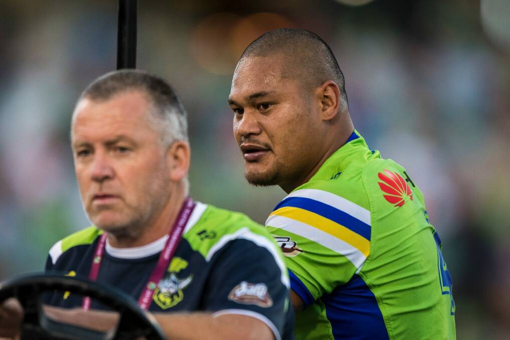 Centre Joey Leilua leaves the field on a medicab on Sunday night. Photo: Dion Georgopoulos