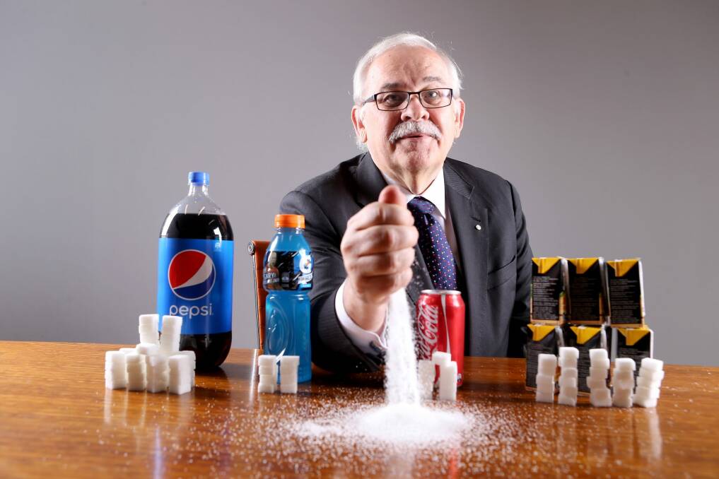 A tax on sugar? Grattan Institute health director Stephen Duckett with popular drinks and the sugar content of each in cubes. Photo: Wayne Taylor