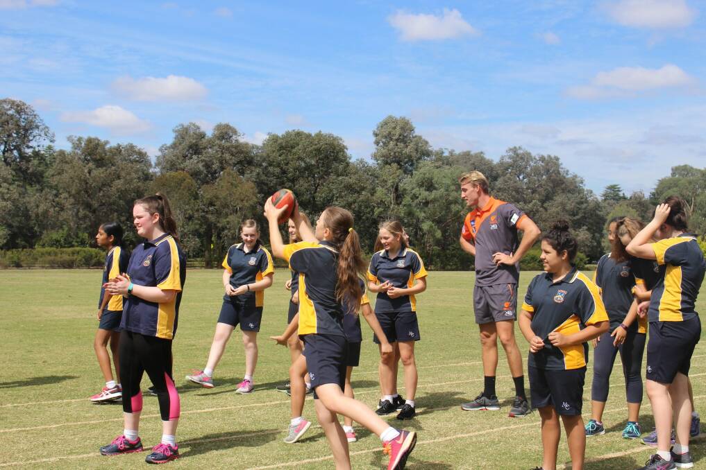 GWS Giants players ran clinics at Merici College as the school builds a team to play in AFL Canberra. Photo: Ros Parisi