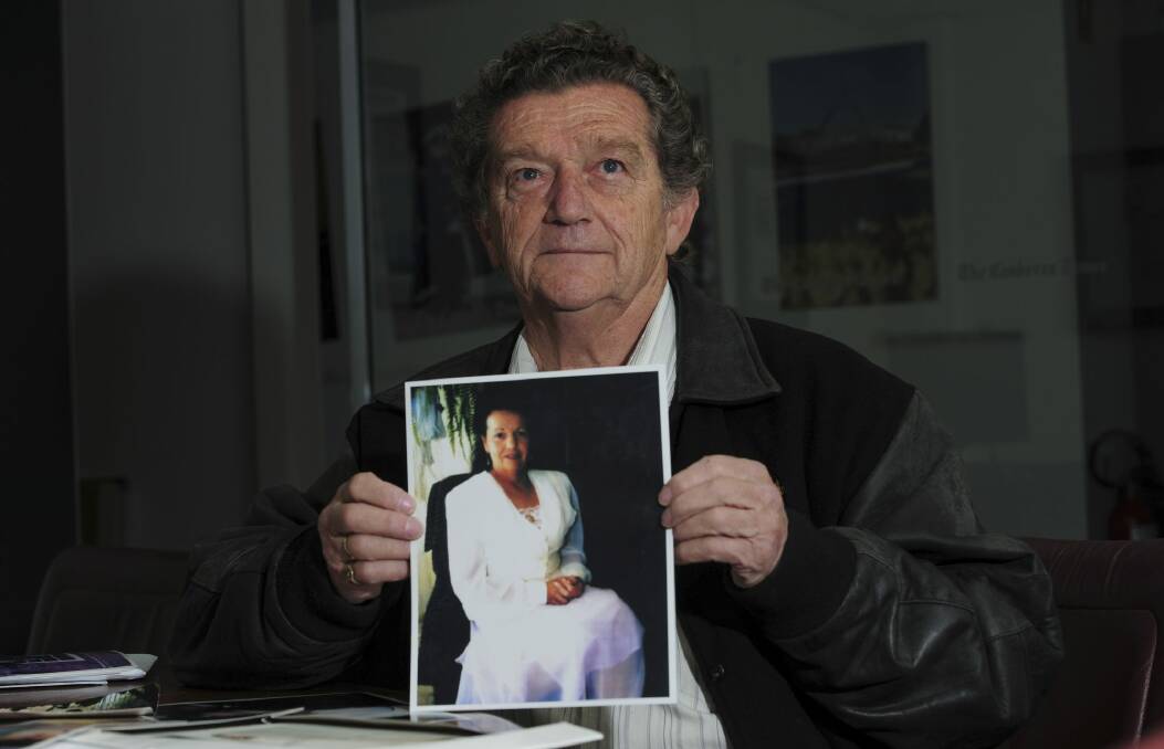 Tom Griffiths of Lyons with a photograph of his deceased wife, Carol. Photo: Graham Tidy