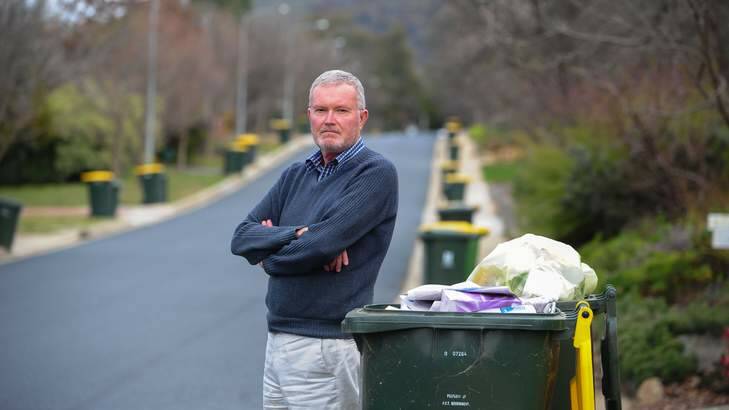 Red Hill resident David Robertson says with warmer weather there is starting to be a smell around the bins. Photo: Katherine Griffiths