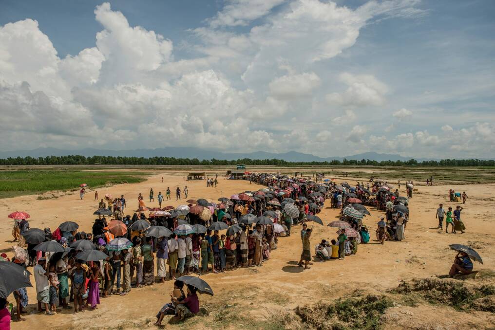 Refugees line up to register near the Nayapara refugee camp in Cox's Bazar, Bangladesh.  Photo: New York Times