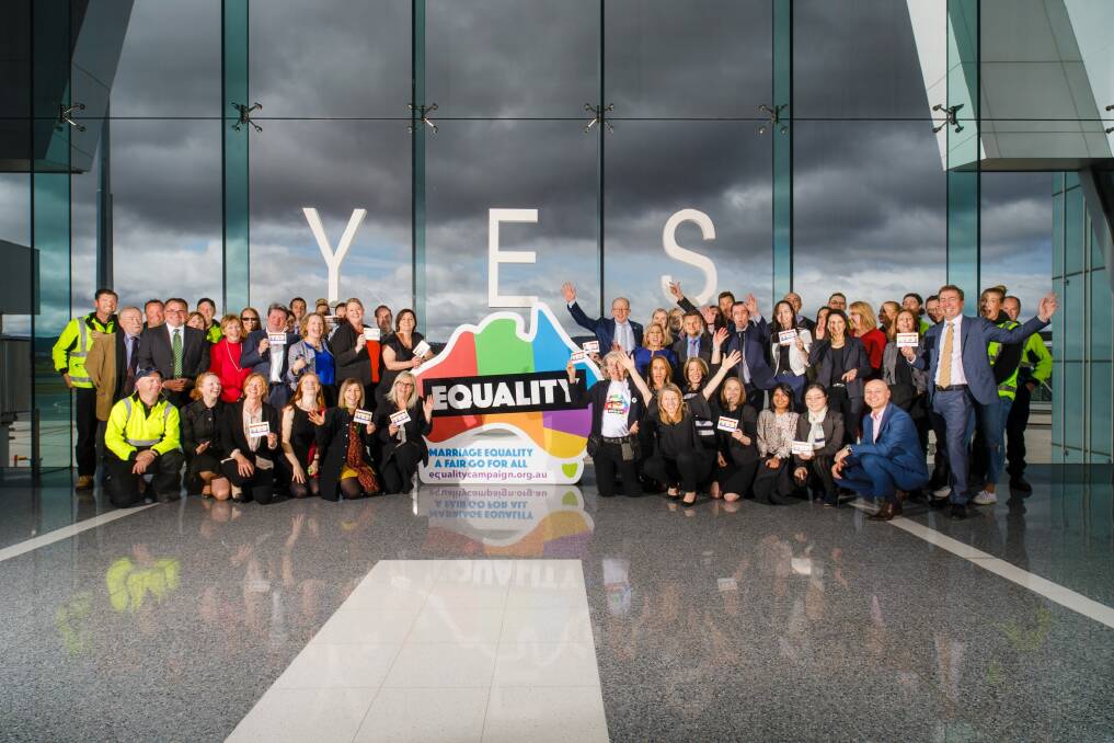 Canberra Airport managing director Stephen Byron with employees in support of marriage equality.  Photo: Sitthixay Ditthavong