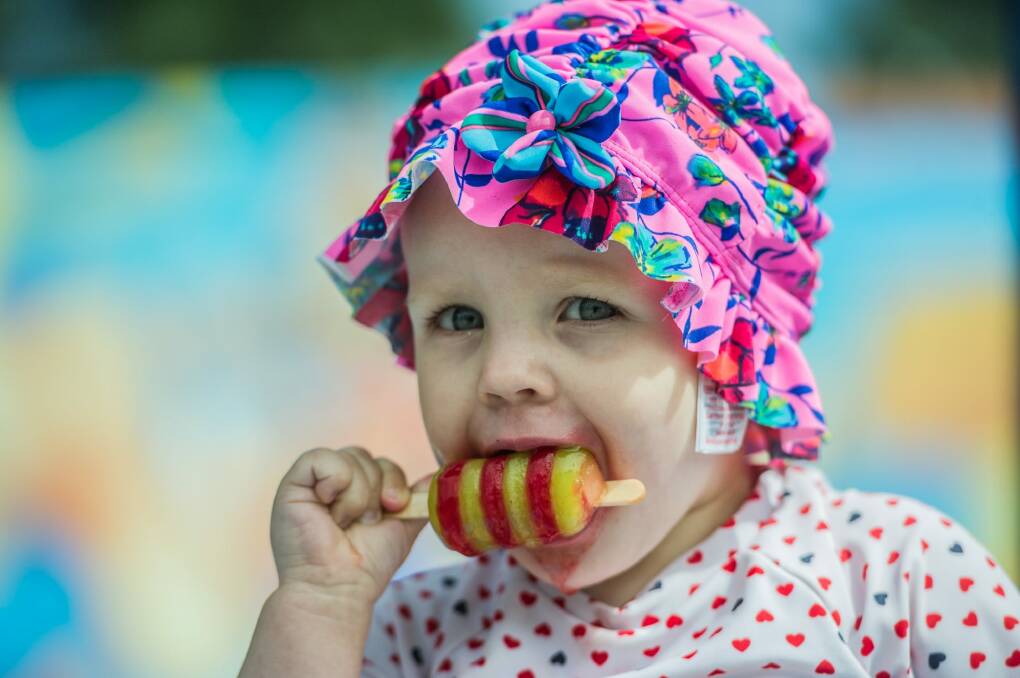 18-month-old Zoe Payne of Casey cools of with the help of an icy pole at Big Splash Waterpark.  Photo: Karleen Minney