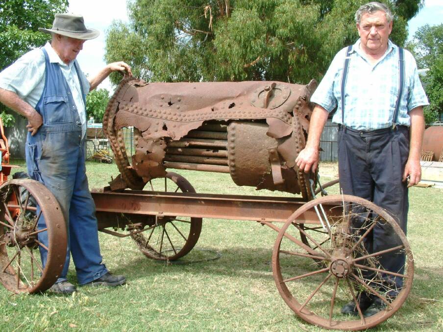 Bungendore brothers Coin and Dave Daniel photographed in 2002 in their Bungendore backyard with the remains of the boiler from the Pioneer a paddlesteamer which plied the waters of Lake George in the late 1800s. Photo: Tim the Yowie Man