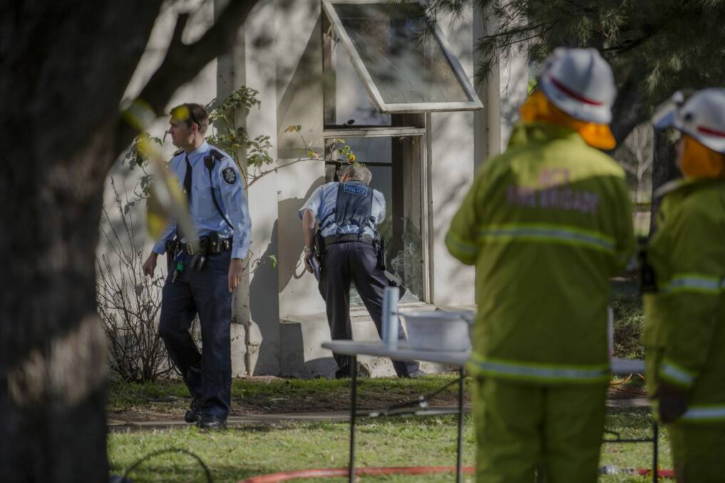 Emergency services inspect the Lyneham Flats after a fire started in a ground floor unit on Thursday. Photo: Jamila Toderas