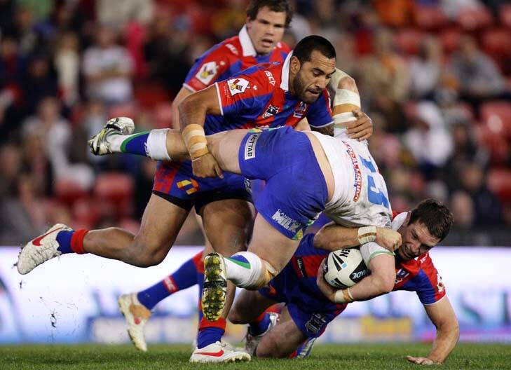 Shaun Fensom of the Raiders is upended. Photo: Getty Images