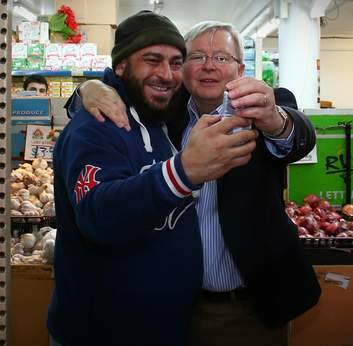 Selfie time! Prime Minister Kevin Rudd visited Abu Hussein mixed business in South Granville, western Sydney. Photo: Andrew Meares