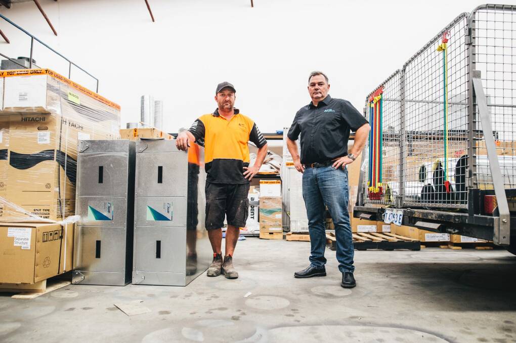 Astor Air Conditioning site supervisor Greg Axon and director Johan Esterhuizen. Their business is owed money from ACT building company SMI. Photo: Rohan Thomson