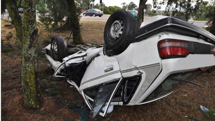 A young woman was lucky to escape serious injuries when she lost control of her car on Coulter Drive in Florey at 5.50am. Photo: Supplied by ACT Policing