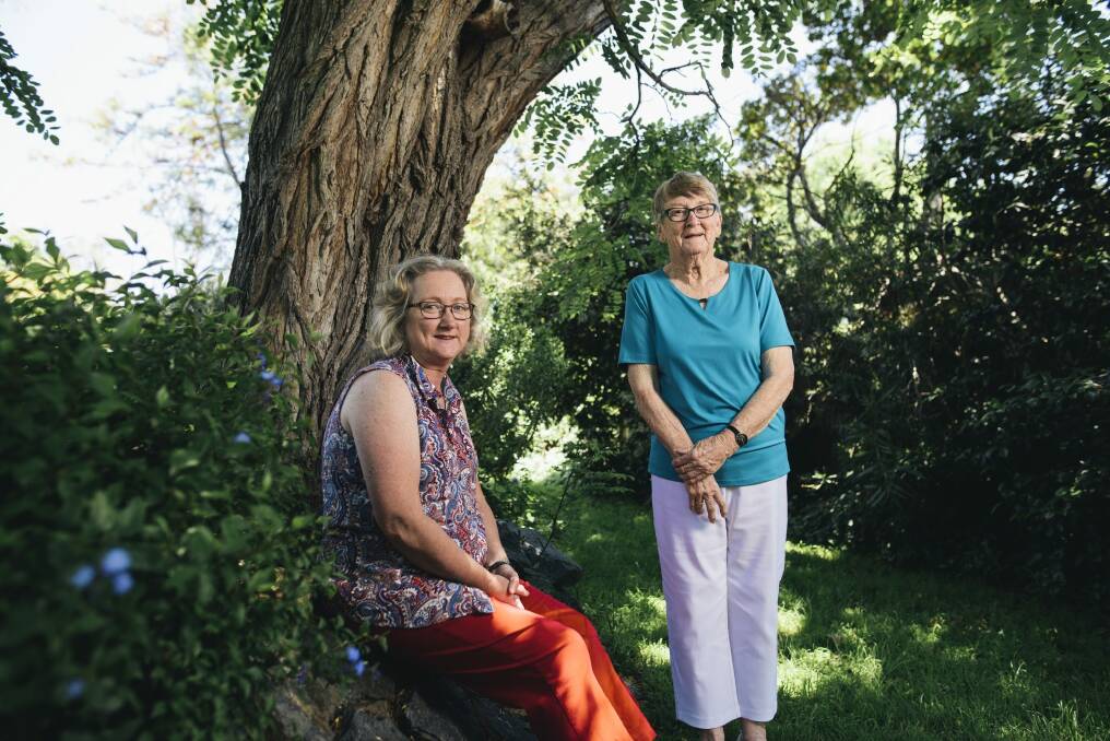 Mother and daughter, Thea Foster and Bronwyn Barnard in the backyard of the the family home under the Robina Pseudoacacia tree which inspired a memorial for those who lose their lives to illicit drugs. Photo: Rohan Thomson