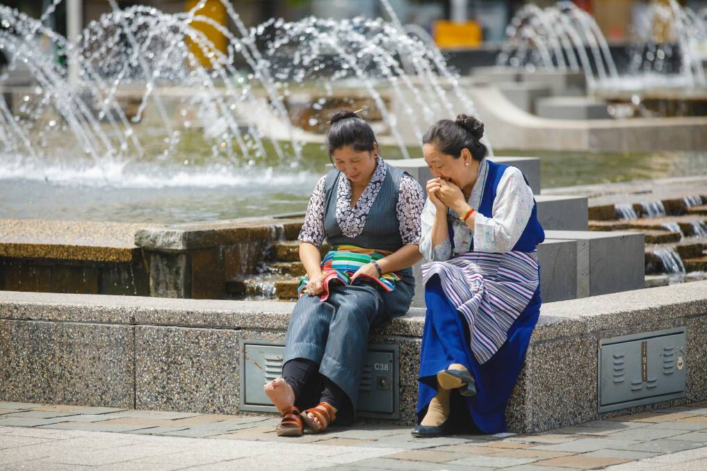 Members of the ACT Tibetan community in Civic square wait for the launch of the National Multicultural festival. Photo: Sitthixay Ditthavong