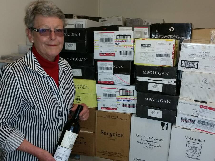Virginia Rawling with some of the 500-plus entries for next week's Australian Cool Climate Wine Show at Murrumbateman. Photo: Supplied