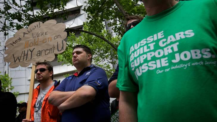 Union workers protest against the Abbott Government's decision not to continue subsidising Holden car manufacturing in Australia. Photo: Jason South