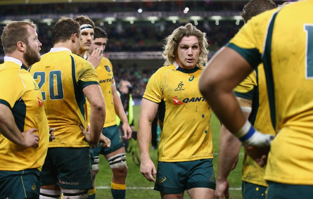 Young skipper: James Hooper talks to teammates during the Wallabies’ Test against Ireland in Dublin last month. Photo: Getty Images