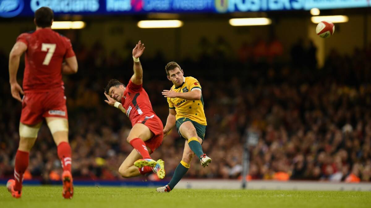 Bernard Foley boots the game-breaking drop goal. Photo: Getty Images