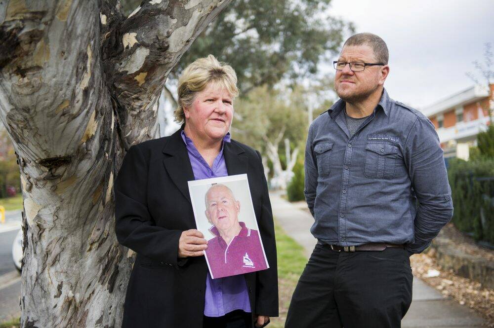 Catherine and David Knight, with a picture of their late father Bob Knight, want illicit firearms off the streets.  Photo: Rohan Thompson