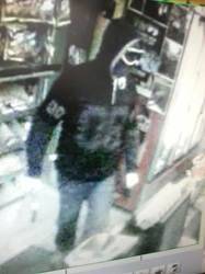 CCTV vision of the man wanted over the robbery. Photo: ACT Policing