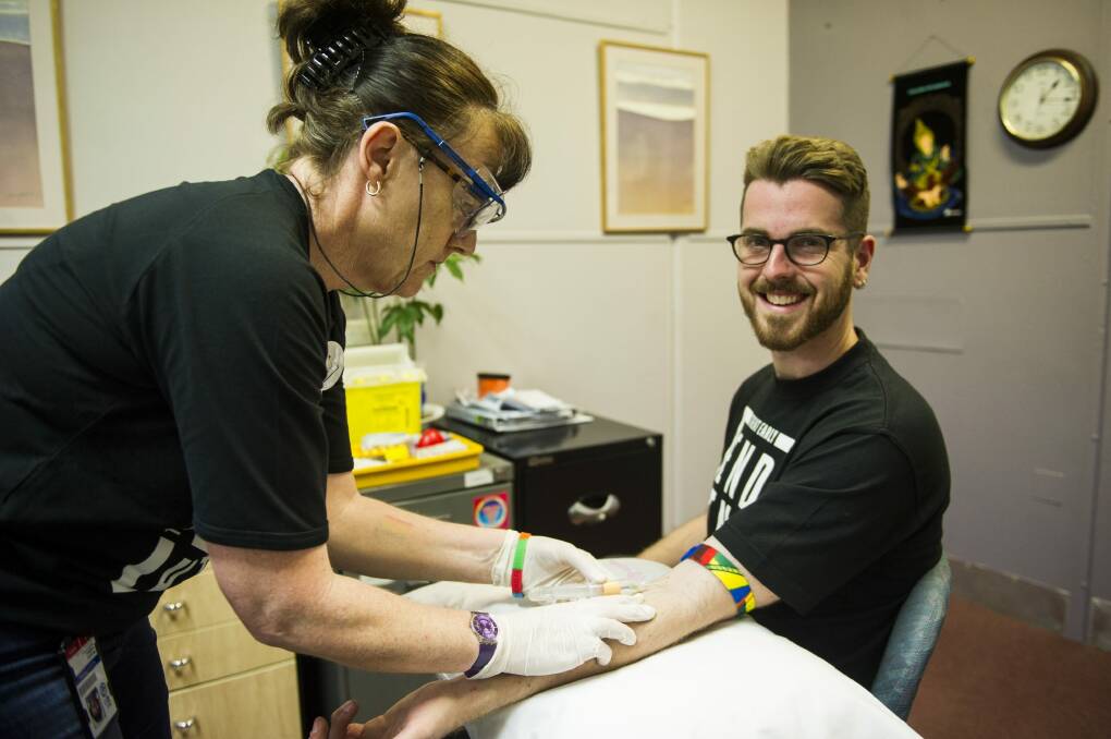 Health check: AIDS Action Council ACT education officer Ben Martin undergoes a sexual health test at the hands of registered nurse Maudie Todkill. Photo: Jay Cronan