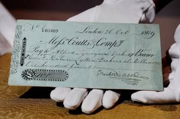 A cheque for 100 pounds signed by Charles Dickens. Photo: Colleen Petch