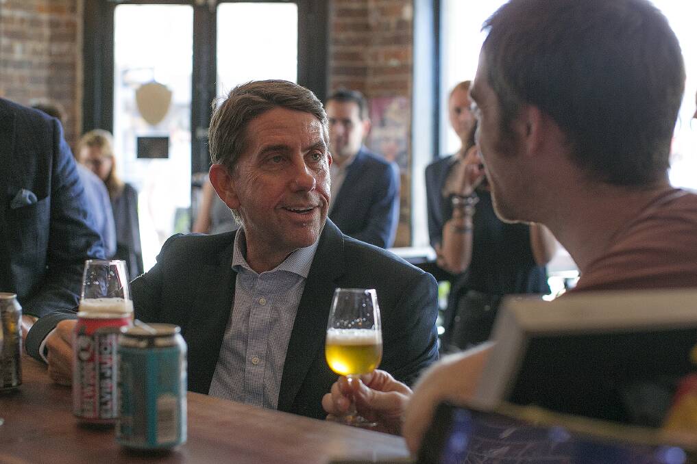 State Development Minister Cameron Dick tastes a beer with BrewDog co-founder Martin Dickie. Photo: Supplied