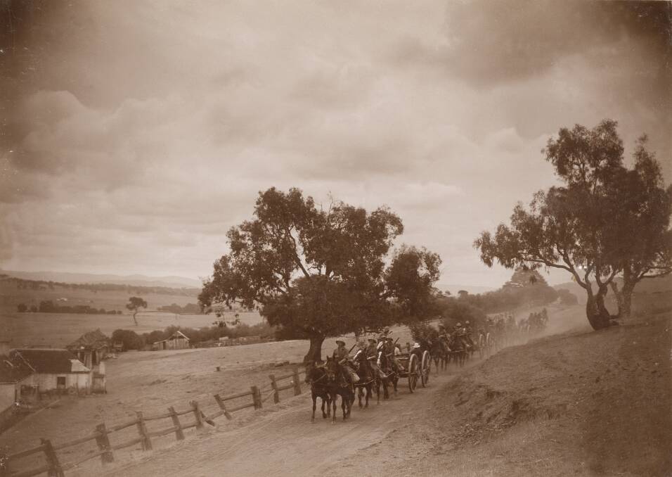 Horse-drawn artillery teams travel along Lavarack Road, Duntroon in 1914.  Photo: NLA and ACT Heritage