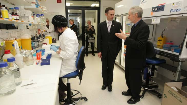 Professor Chris Parish, right, Fraser MP Andrew Leigh through the John Curtin School of Medical Research at the ANU. <em> File photo: Alex Ellinghausen </em> Photo: Alex Ellinghausen
