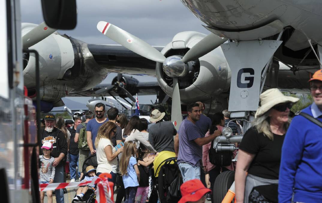 A huge crowd lines up to see the aircraft displays. Photo: Graham Tidy