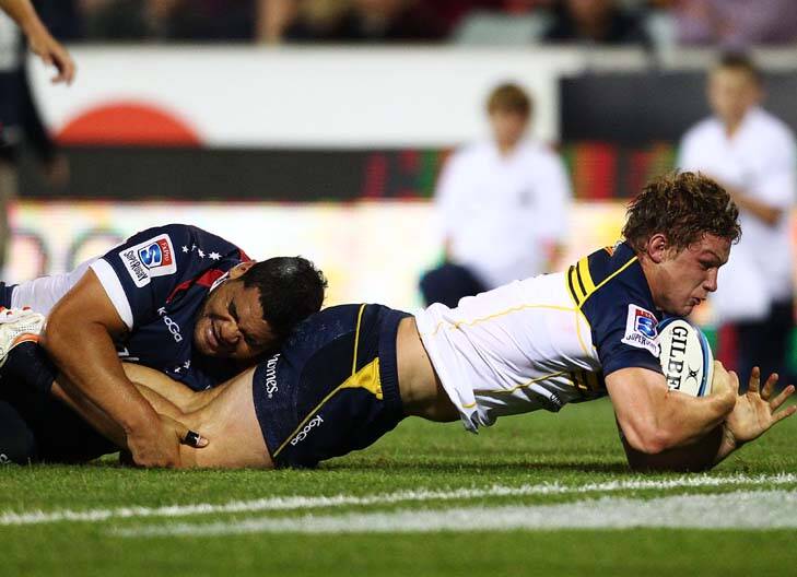 Over ... Michael Hooper scores for the Brumbies. Photo: Getty Images