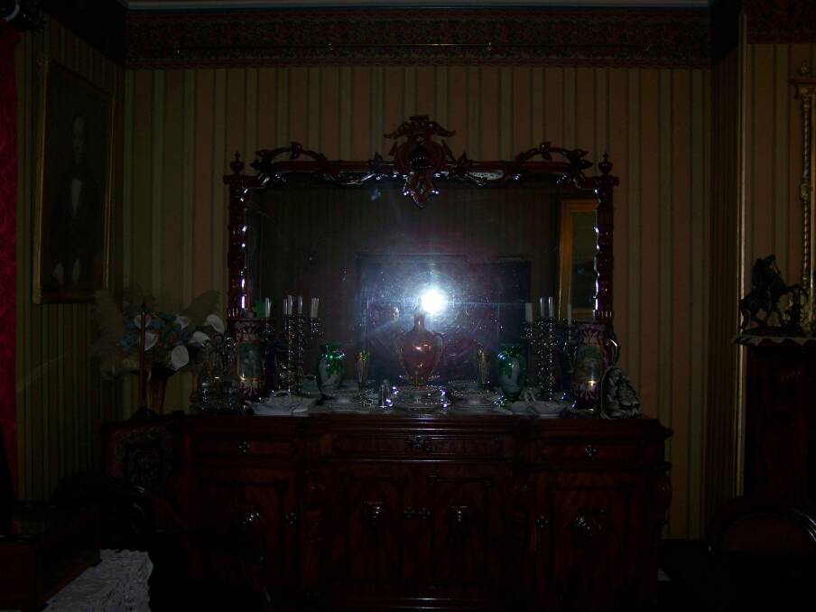 Katherine Saliba captured this image (look to left of the vase) in a photo at Monte Cristo which she believes may be the spirit of Mrs Crawley, one of the home's original owners.  Photo: Katherine Saliba