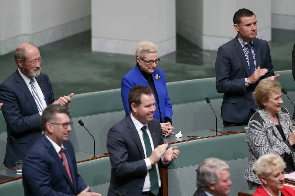 Former speaker Bronwyn Bishop holds her hands as other MPs applaud the election of Tony Smith as her replacement on Monday. Photo: Alex Ellinghausen