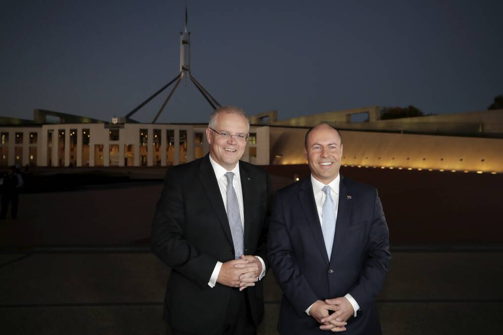Prime Minister Scott Morrison and Treasurer Josh Frydenberg arrive for early morning interviews at Parliament House on Wednesday after delivering a budget that promised tax cuts in the years to come. Photo: Alex Ellinghausen
