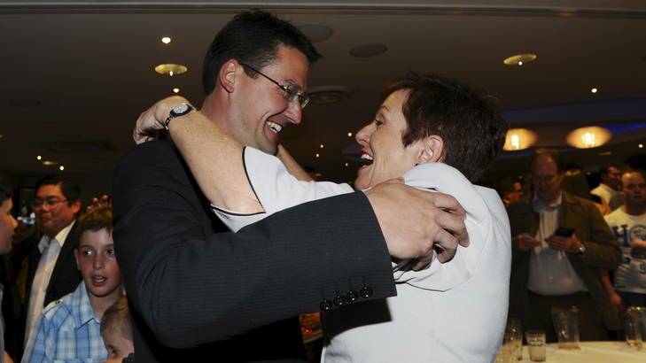 Liberal leader Zed Seselja enters the Liberal post-election party and is greeted by Kate Carnell. Photo: Colleen.Petch@canberratimes.com.