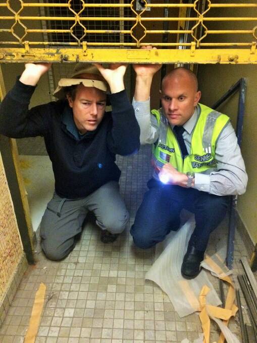 Bren Burkevics and Tim the Yowie Man snoop around the subterranean world of the Woden bus interchange. Photo: Tanya Barnes